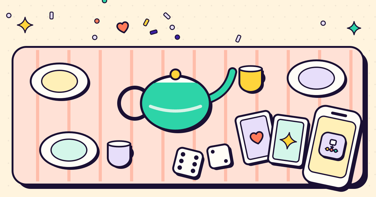 Una mesa larga puesta para una reunión familiar, con cartas, dados, una tetera y un celular entre los platos